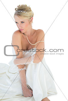 Thoughtful sensuous bride white background