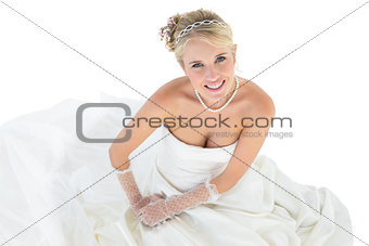 Portrait of bride sitting over white background
