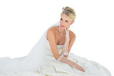 Thoughtful bride over white background