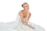 Sensuous woman in wedding dress over white background