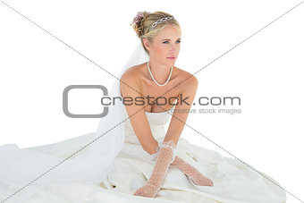 Woman in wedding dress looking away