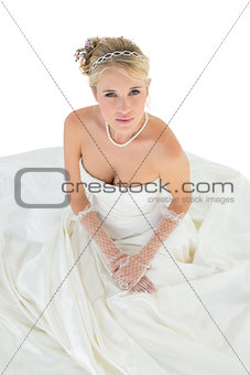 Elegant bride in wedding dress over white background