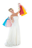 Bride carrying shopping bags over white background