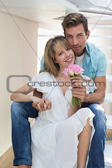 Portrait of a loving couple with flowers