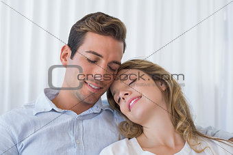 Close-up of a loving young couple with eyes closed