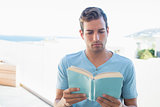 Concentrated man reading book