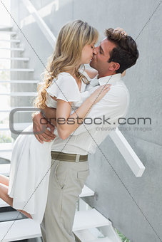 Loving young man carrying woman