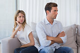 Couple not talking after an argument in living room