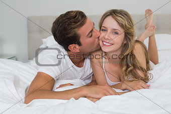 Close-up of a loving couple lying in bed