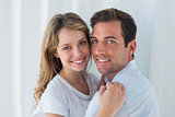 Close-up portrait of a loving couple embracing