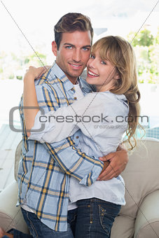 Side view portrait of loving couple embracing