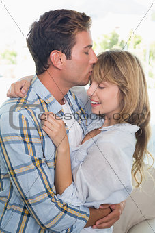 Side view of a loving couple embracing
