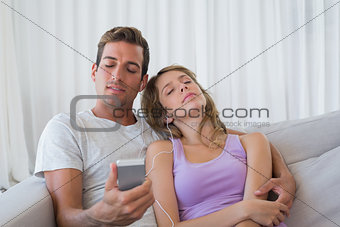 Couple listening music with mobile phone