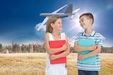 Composite image of smiling brother and sister holding their exercise books