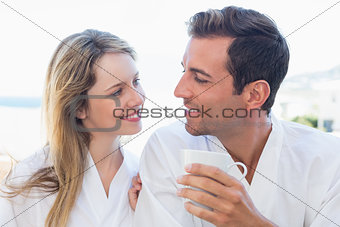 Close-up of a happy couple having coffee