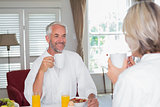 Couple having breakfast at home