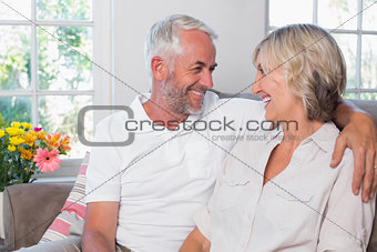 Cheerful mature couple looking at each other