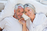 High angle portrait of a mature couple lying in bed