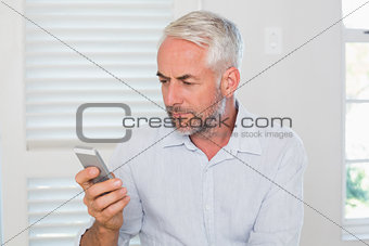 Serious mature man text messaging