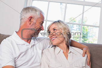 Relaxed mature couple looking at each other