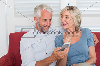 Mature couple reading text message