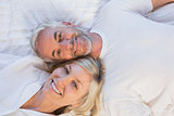 High angle portrait of a mature couple lying in bed