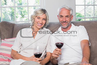 Portrait of a relaxed mature couple with wine glasses