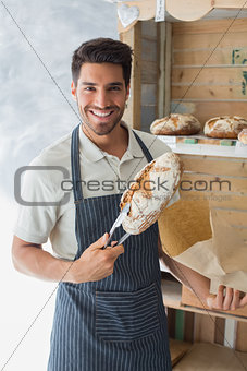 Male cafe owner with sweet food at coffee shop
