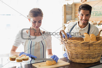 People with croissants at coffee shop counter