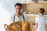Waiter with basket of breads at the coffee shop