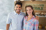 Couple with arm around at the bakery