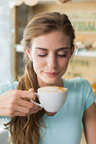 Woman drinking coffee in coffee shop