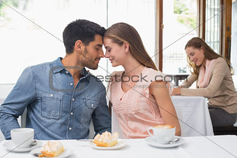 Romantic couple having coffee at coffee shop