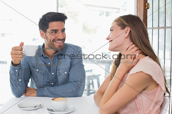 Portrait of a smiling couple at coffee shop