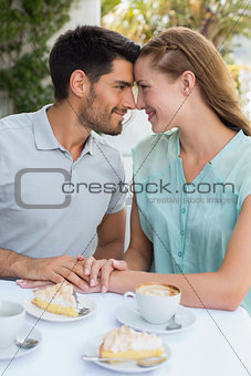 Couple looking at each other at coffee shop