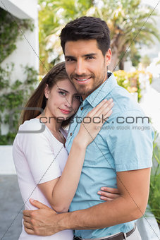 Loving young couple embracing outdoors