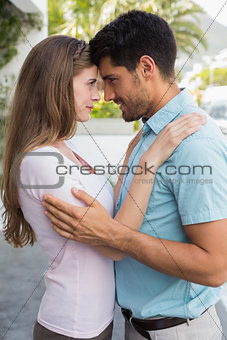 Loving couple looking at each other outdoors