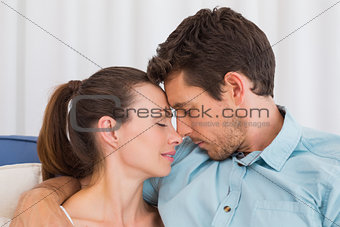 Loving young couple with eyes closed