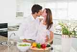 Loving couple kissing in the kitchen