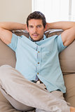 Portrait of a relaxed man sitting on couch