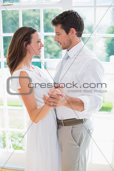 Loving young couple holding hands