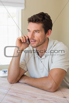 Man using mobile phone at home