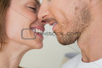 Loving young couple about to kiss