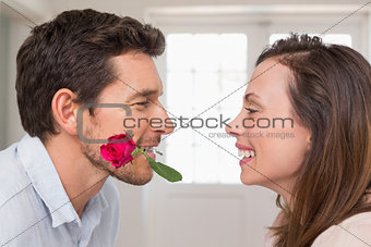 Loving couple looking at each other at home