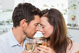 Loving couple with wine glasses at home