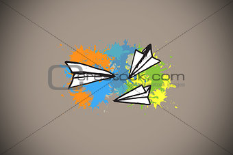 Composite image of paper airplanes on paint splashes