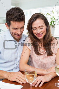 Couple with wine glass at home