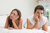 Couple not talking after an argument in bed