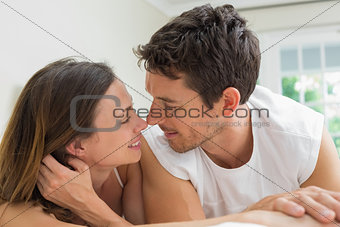 Close-up of a relaxed couple lying in bed