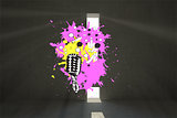 Composite image of microphone on paint splashes